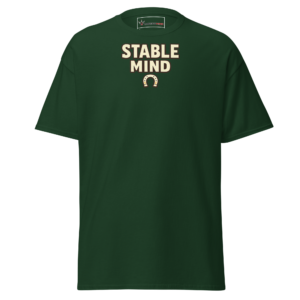 Front view of a forest-green T-Shirt featuring cream “Stable Mind” lettering above a small horseshoe symbol