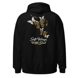 Back view of a black Hoodie featuring three pale butterflies above “Soft Wings, Wild Soul” lettering