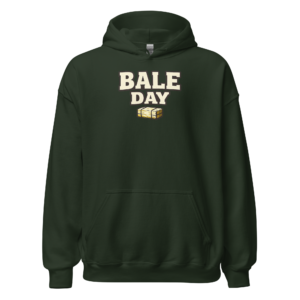 Front view of a forest-green Hoodie featuring cream “Bale Day” lettering above a compact hay-bale illustration
