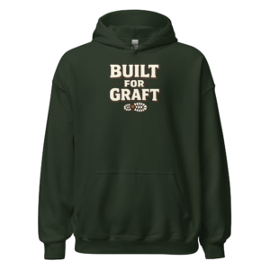 Front view of a forest-green Hoodie featuring bold cream “Built For Graft” lettering above a small boot-tread motif