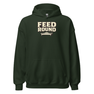 Front view of a forest-green Hoodie featuring cream “Feed Round” lettering above a small feeding-trough illustration