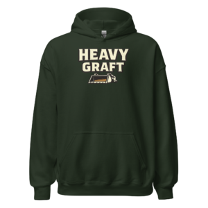 Front view of a forest-green Hoodie featuring cream “Heavy Graft” lettering above a compact loader-bucket symbol