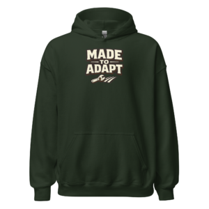 Front view of a forest-green Hoodie featuring cream “Made To Adapt” lettering above a small field-and-tool motif