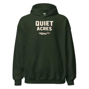 Front view of a forest-green Hoodie featuring cream “Quiet Acres” lettering above a small field-line illustration