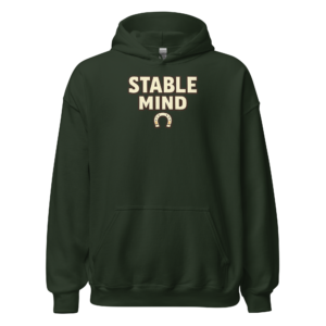 Front view of a forest-green Hoodie featuring cream “Stable Mind” lettering above a small horseshoe symbol